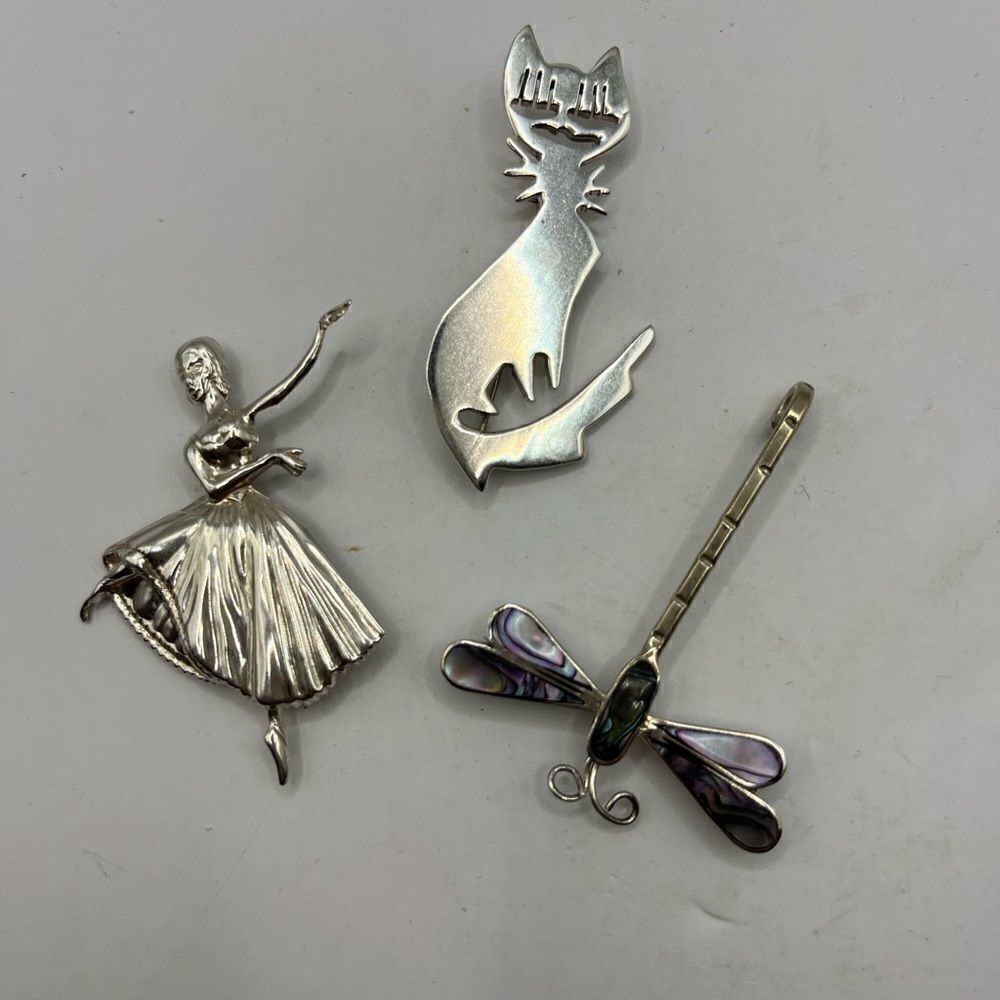 Lot of three vintage sterling pins/ brooches.
